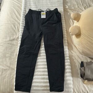 Nike men’s. Standard fit taper leg regular length. Size small. New with tags.